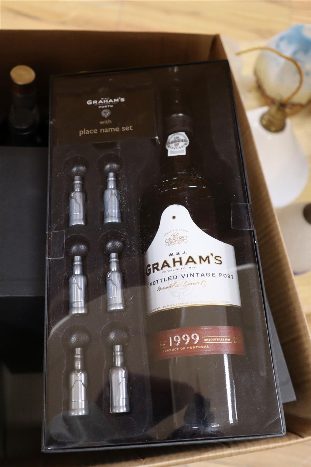 Eleven bottles of non-vintage port; four Grahams 19998/9, five Dows Sandeman and Taylors.